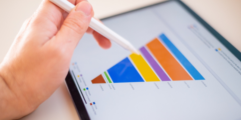 A person looking at a sales funnel on a tablet.