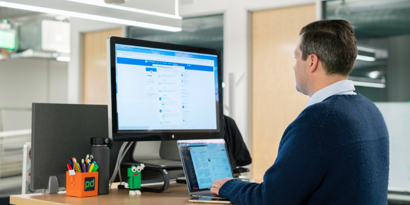 A person at their work desk on LinkedIn.