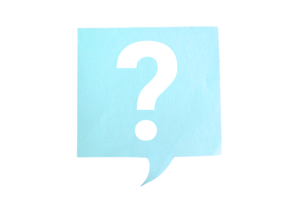 A question mark cut out of a piece of paper that looks like a chat box.