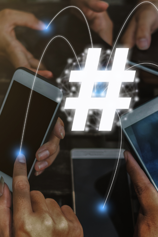 A group of people on social media with a large hashtag symbol over it