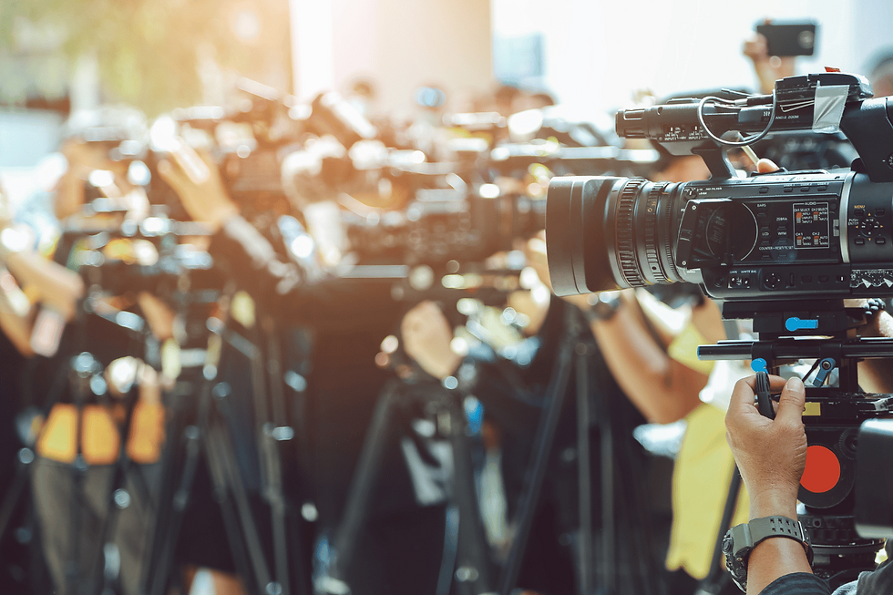 Members of the press lined up with their professional cameras.