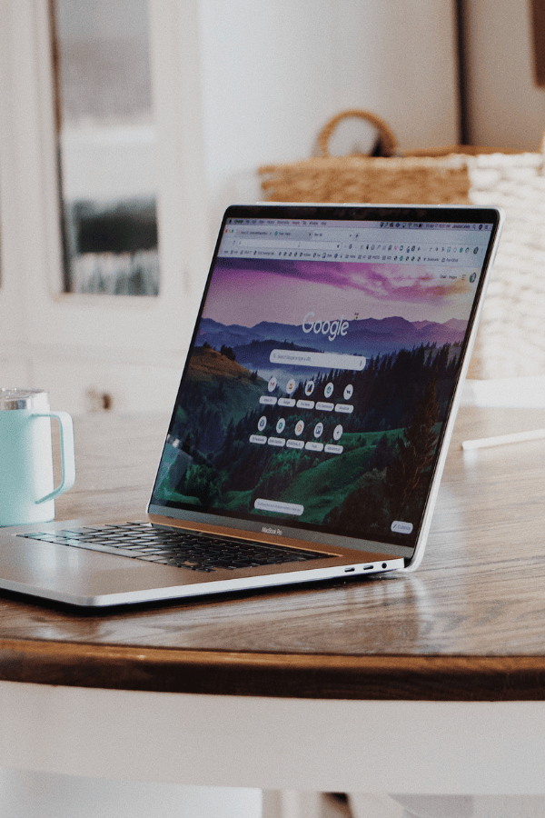 A laptop sitting on a table with a Google search open on the screen.